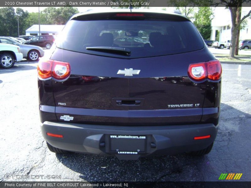 Dark Cherry Metallic / Dark Gray/Light Gray 2010 Chevrolet Traverse LT AWD