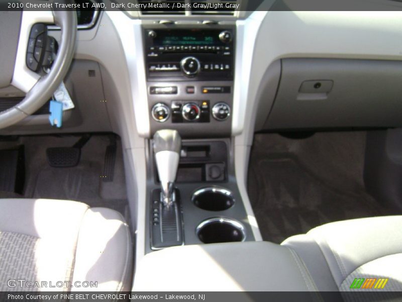Dark Cherry Metallic / Dark Gray/Light Gray 2010 Chevrolet Traverse LT AWD