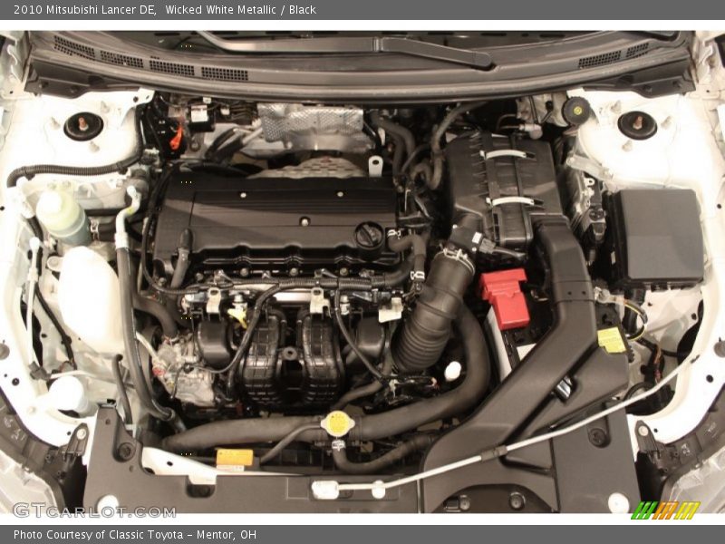 Wicked White Metallic / Black 2010 Mitsubishi Lancer DE
