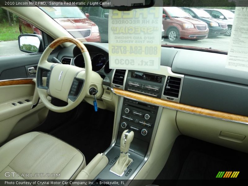Sangria Red Metallic / Light Camel 2010 Lincoln MKZ FWD
