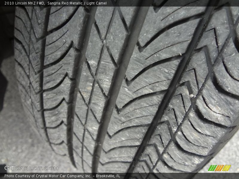 Sangria Red Metallic / Light Camel 2010 Lincoln MKZ FWD