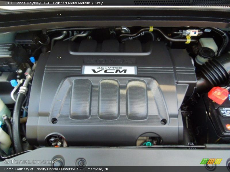 Polished Metal Metallic / Gray 2010 Honda Odyssey EX-L