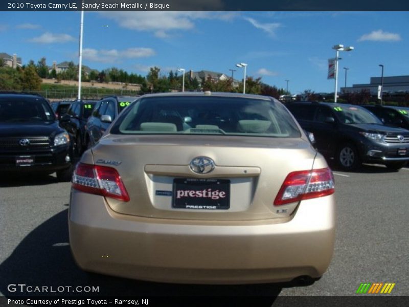 Sandy Beach Metallic / Bisque 2010 Toyota Camry LE