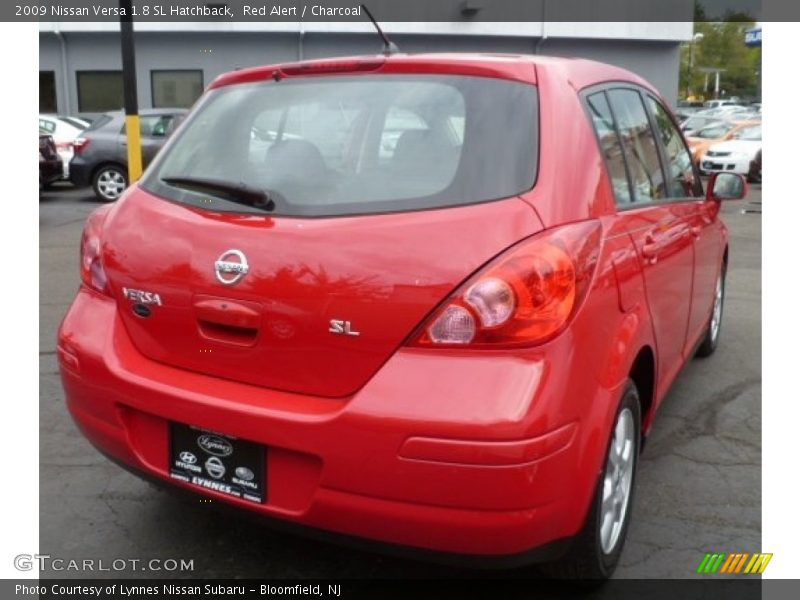 Red Alert / Charcoal 2009 Nissan Versa 1.8 SL Hatchback