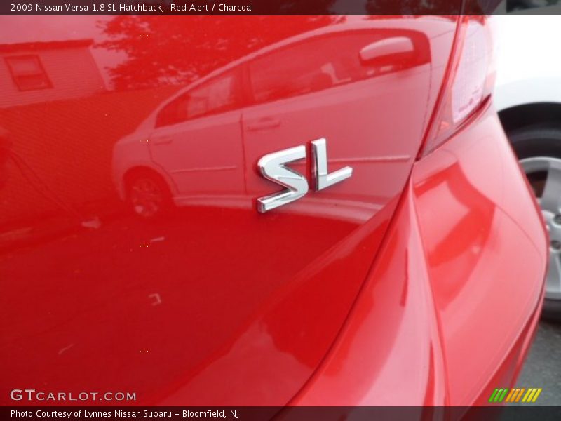 Red Alert / Charcoal 2009 Nissan Versa 1.8 SL Hatchback