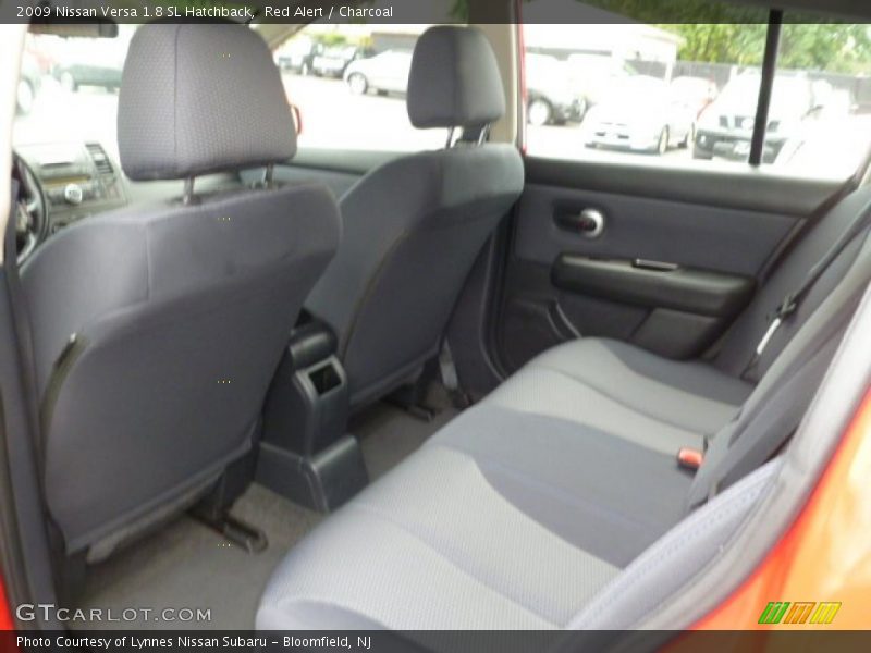 Red Alert / Charcoal 2009 Nissan Versa 1.8 SL Hatchback
