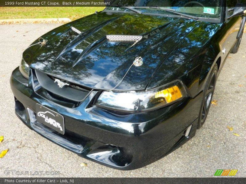 Black / Medium Parchment 1999 Ford Mustang GT Coupe