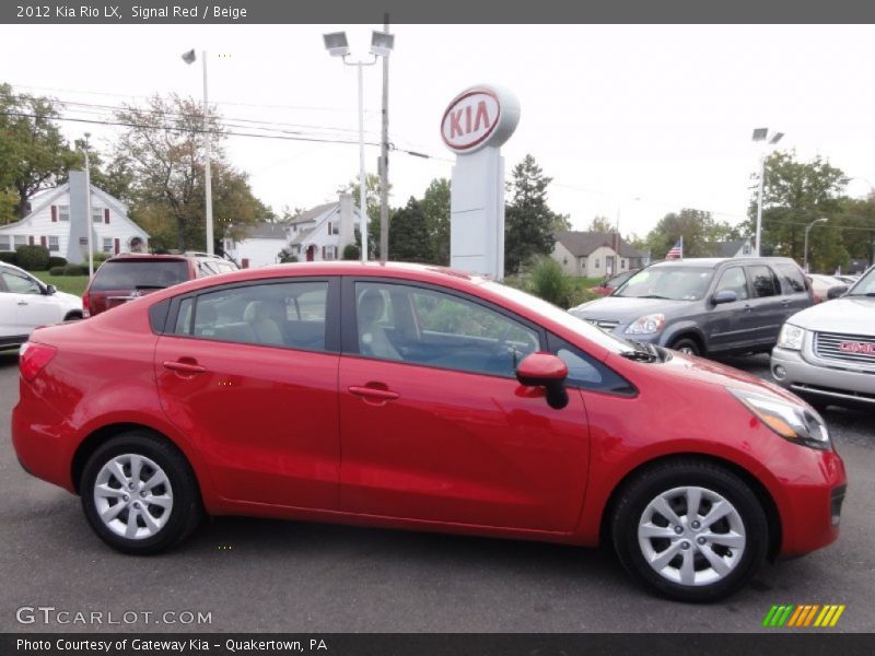  2012 Rio LX Signal Red