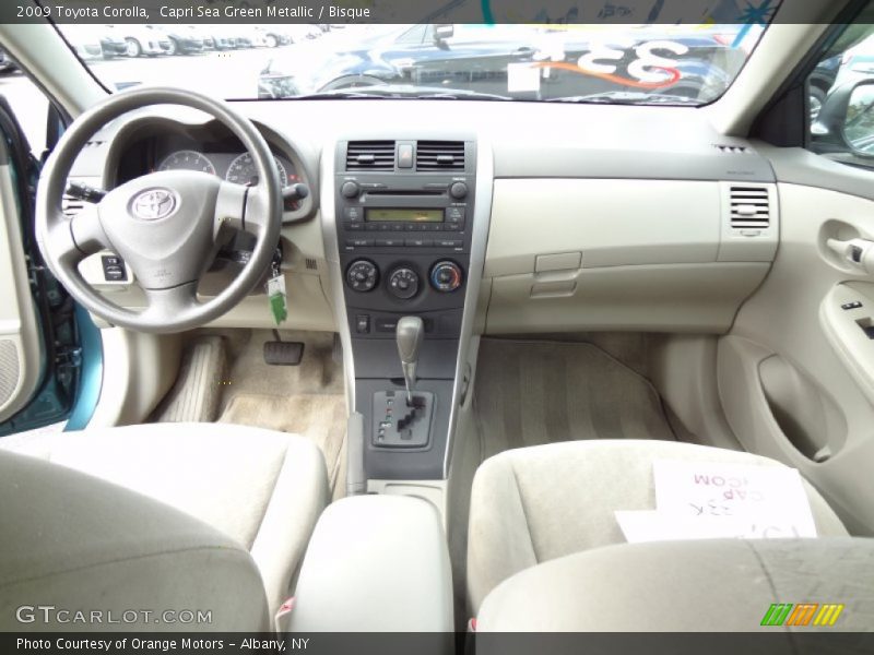 Capri Sea Green Metallic / Bisque 2009 Toyota Corolla