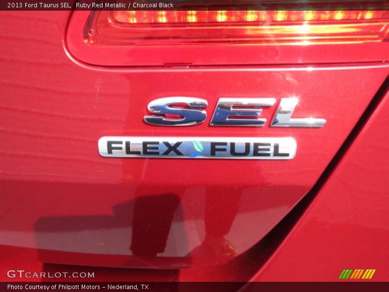 Ruby Red Metallic / Charcoal Black 2013 Ford Taurus SEL