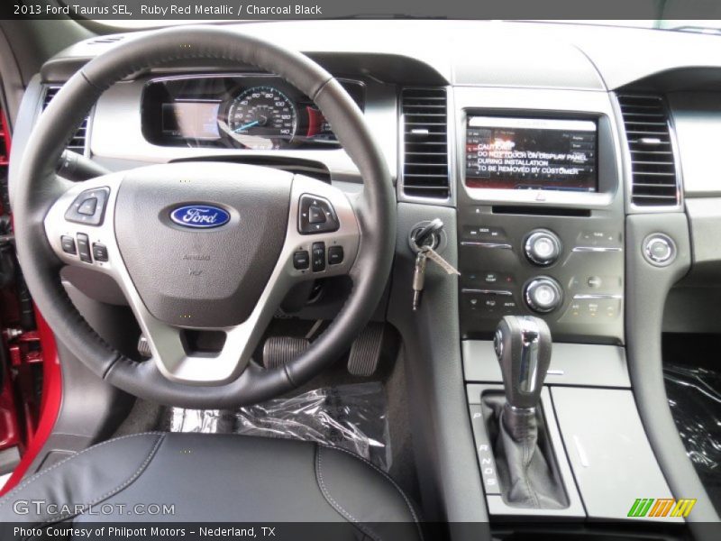 Ruby Red Metallic / Charcoal Black 2013 Ford Taurus SEL