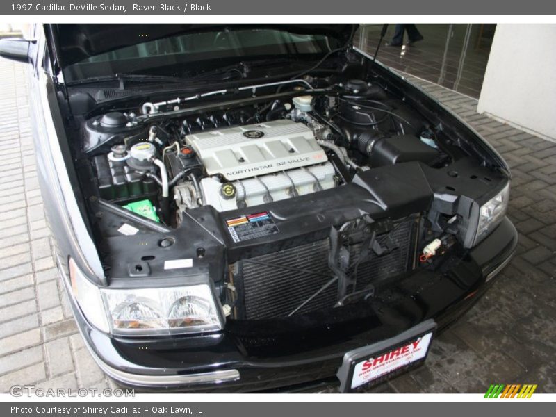Raven Black / Black 1997 Cadillac DeVille Sedan