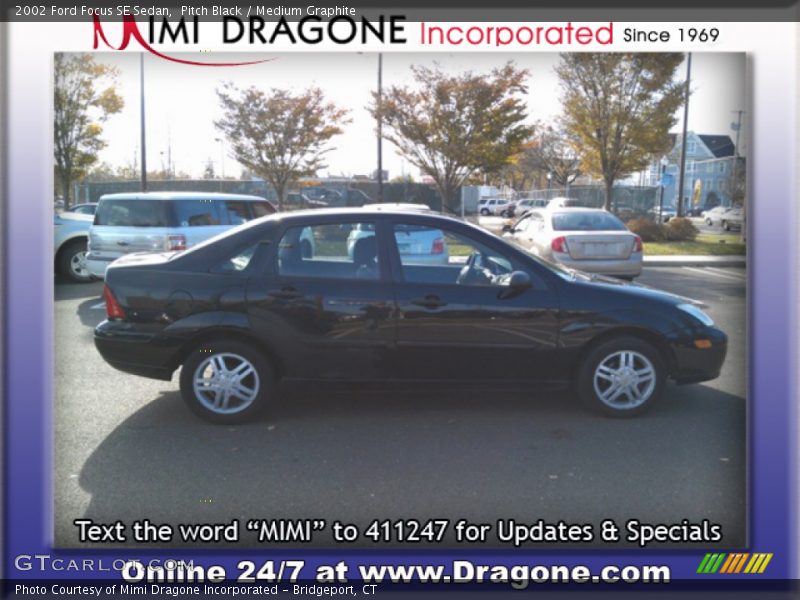 Pitch Black / Medium Graphite 2002 Ford Focus SE Sedan