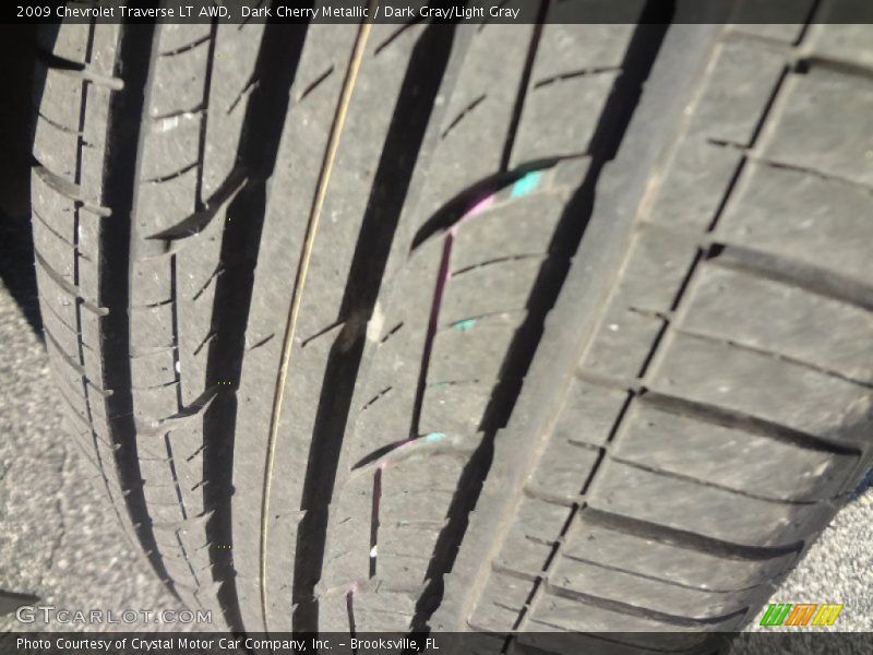 Dark Cherry Metallic / Dark Gray/Light Gray 2009 Chevrolet Traverse LT AWD