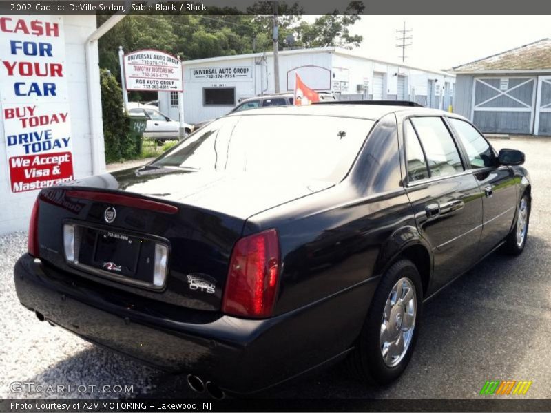Sable Black / Black 2002 Cadillac DeVille Sedan
