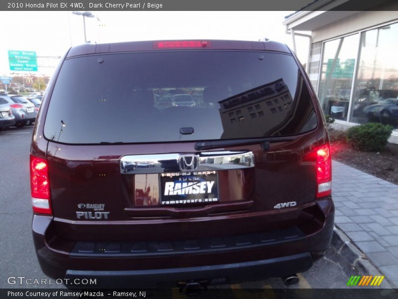Dark Cherry Pearl / Beige 2010 Honda Pilot EX 4WD