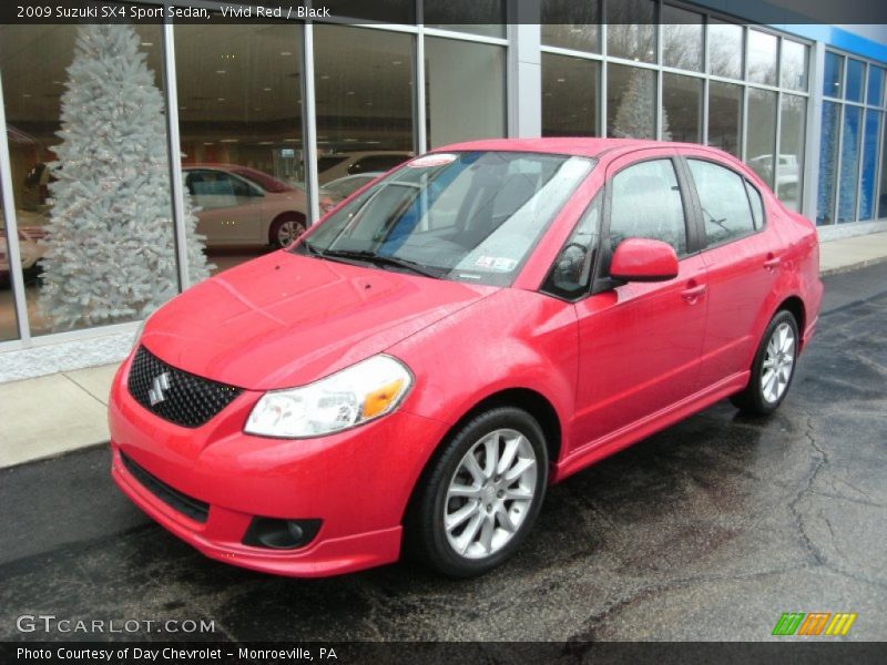 Vivid Red / Black 2009 Suzuki SX4 Sport Sedan