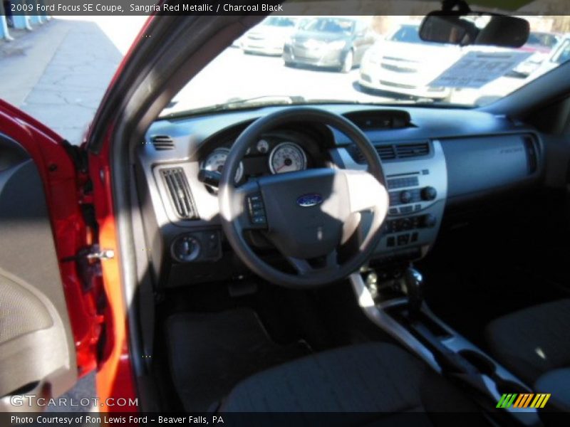 Sangria Red Metallic / Charcoal Black 2009 Ford Focus SE Coupe