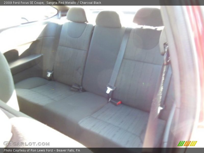 Sangria Red Metallic / Charcoal Black 2009 Ford Focus SE Coupe