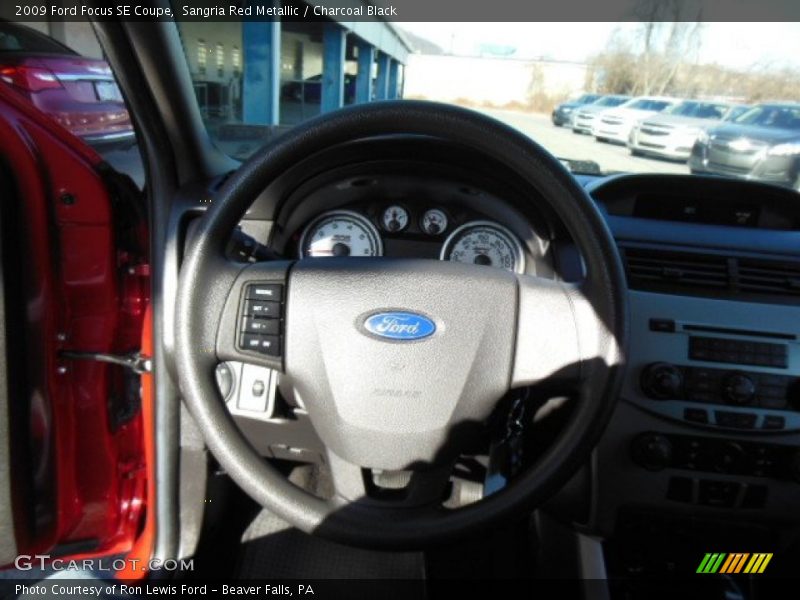 Sangria Red Metallic / Charcoal Black 2009 Ford Focus SE Coupe