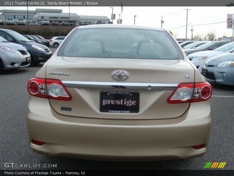 Sandy Beach Metallic / Bisque 2011 Toyota Corolla LE