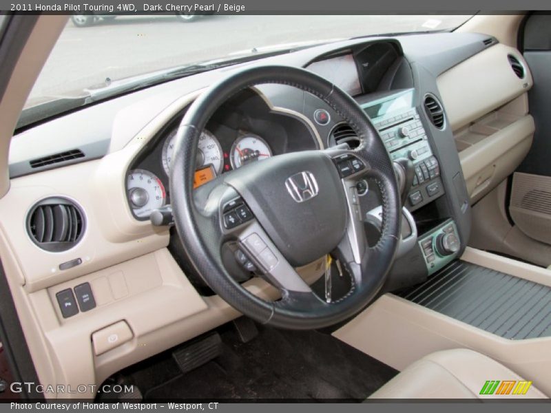 Dark Cherry Pearl / Beige 2011 Honda Pilot Touring 4WD