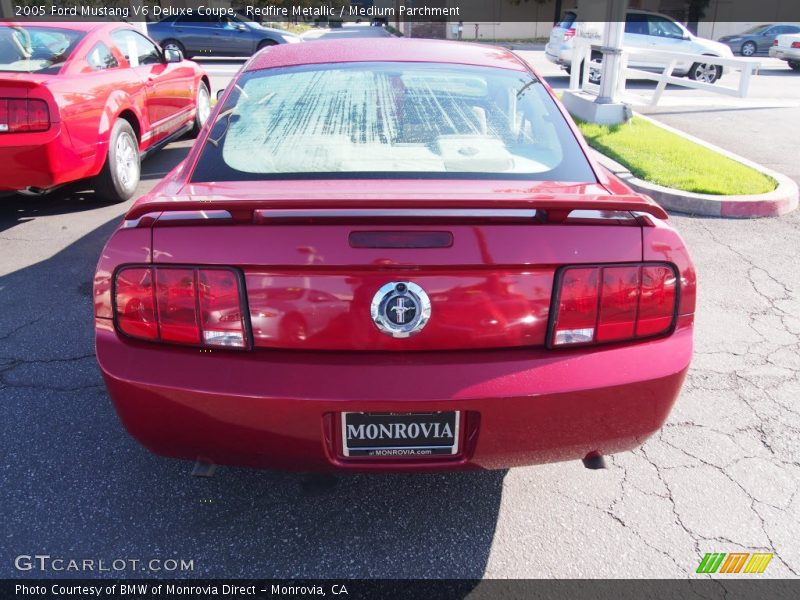 Redfire Metallic / Medium Parchment 2005 Ford Mustang V6 Deluxe Coupe