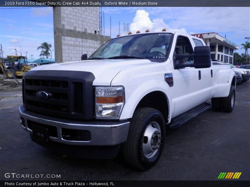 Front 3/4 View of 2009 F350 Super Duty XL Crew Cab 4x4 Dually