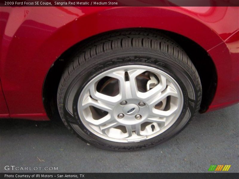 Sangria Red Metallic / Medium Stone 2009 Ford Focus SE Coupe