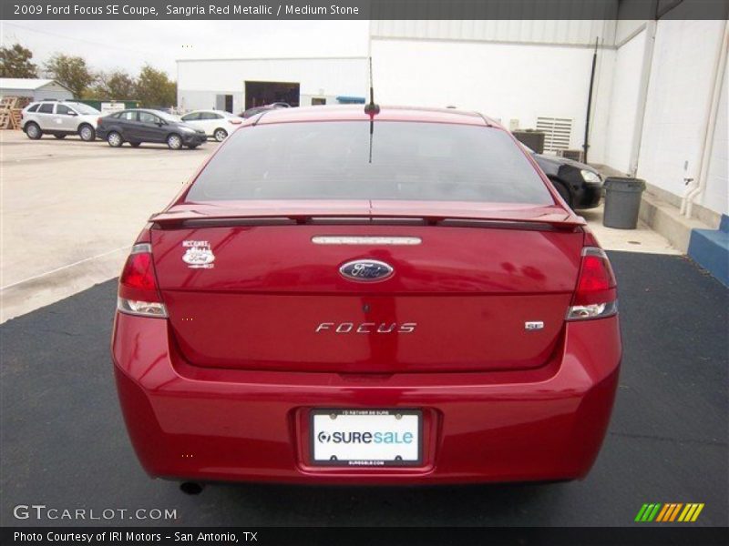 Sangria Red Metallic / Medium Stone 2009 Ford Focus SE Coupe