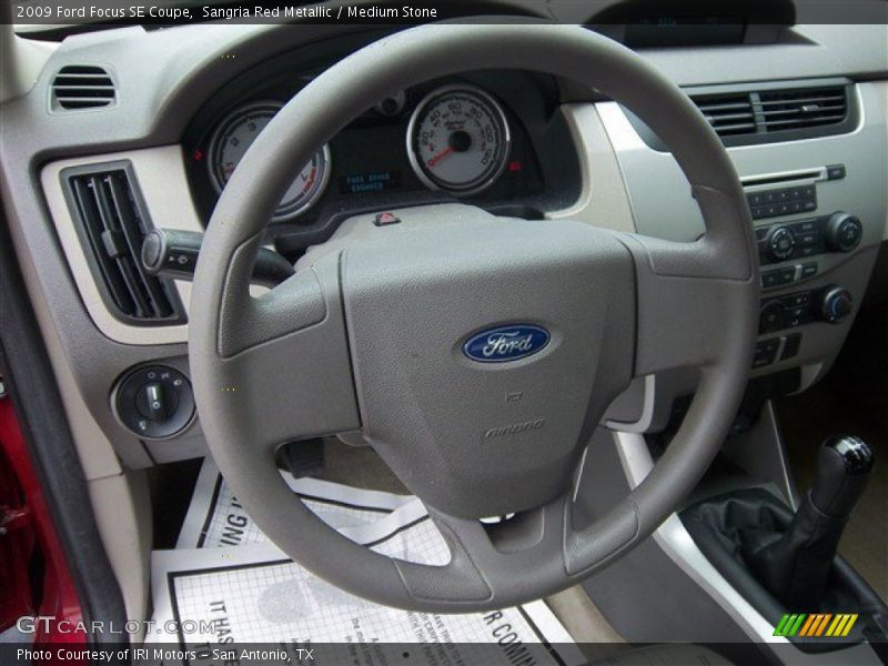 Sangria Red Metallic / Medium Stone 2009 Ford Focus SE Coupe