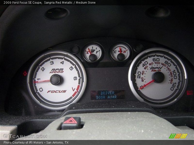 Sangria Red Metallic / Medium Stone 2009 Ford Focus SE Coupe