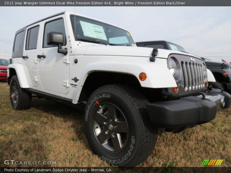 Front 3/4 View of 2013 Wrangler Unlimited Oscar Mike Freedom Edition 4x4
