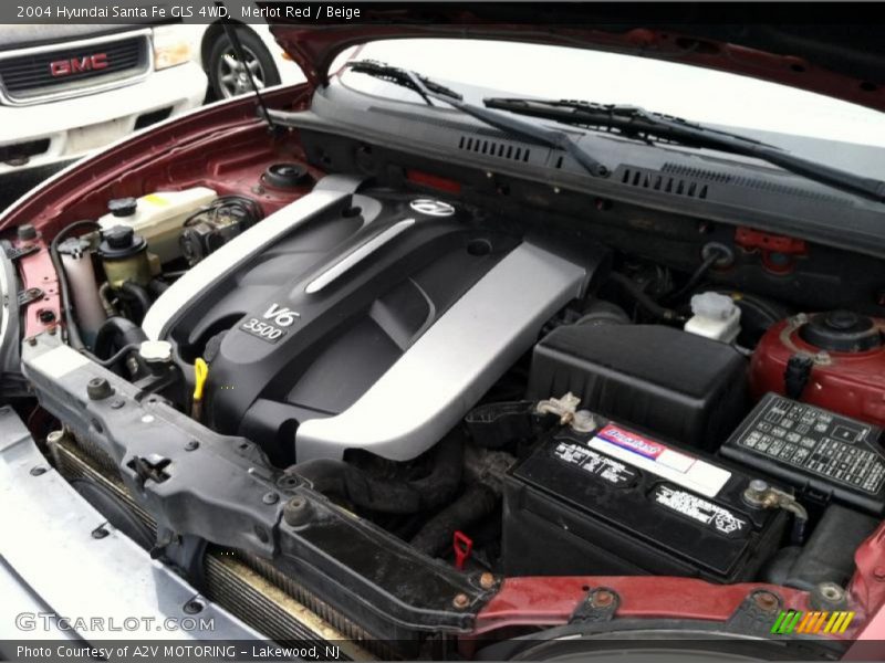 Merlot Red / Beige 2004 Hyundai Santa Fe GLS 4WD