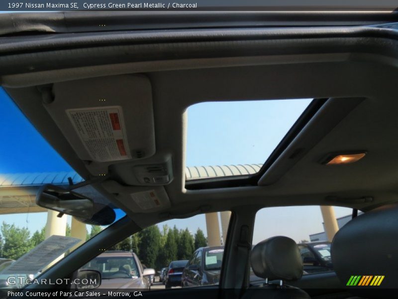Cypress Green Pearl Metallic / Charcoal 1997 Nissan Maxima SE