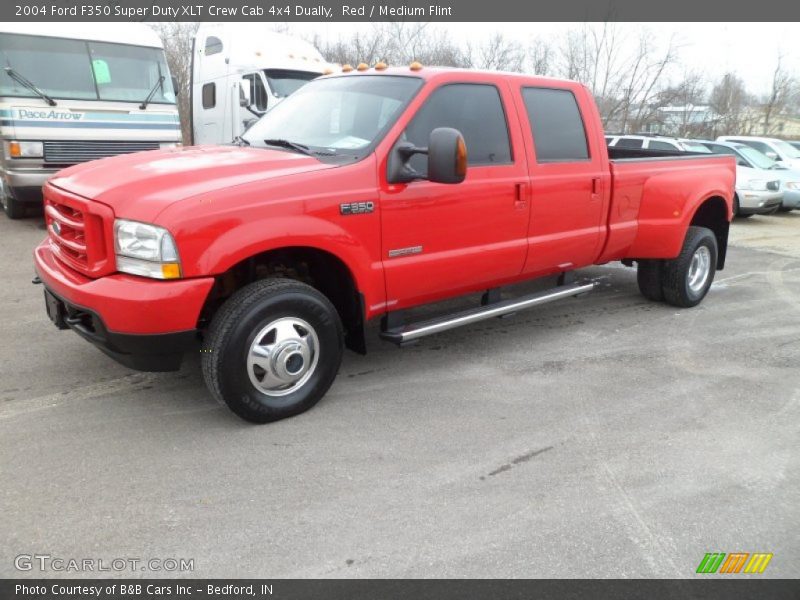 Front 3/4 View of 2004 F350 Super Duty XLT Crew Cab 4x4 Dually