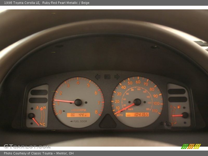Ruby Red Pearl Metallic / Beige 1998 Toyota Corolla LE