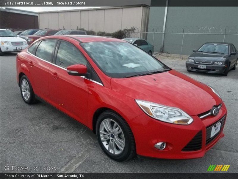 Race Red / Stone 2012 Ford Focus SEL Sedan