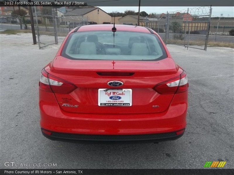 Race Red / Stone 2012 Ford Focus SEL Sedan