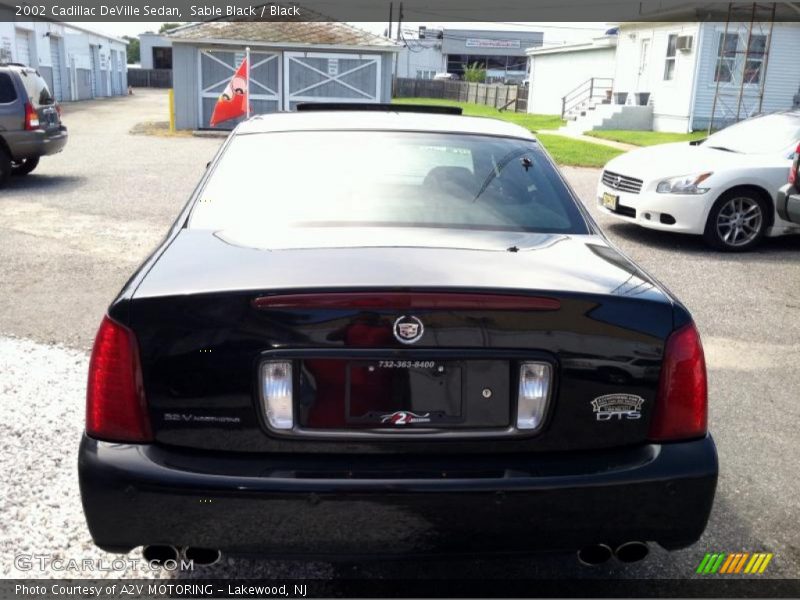 Sable Black / Black 2002 Cadillac DeVille Sedan