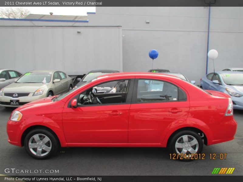 Victory Red / Charcoal 2011 Chevrolet Aveo LT Sedan