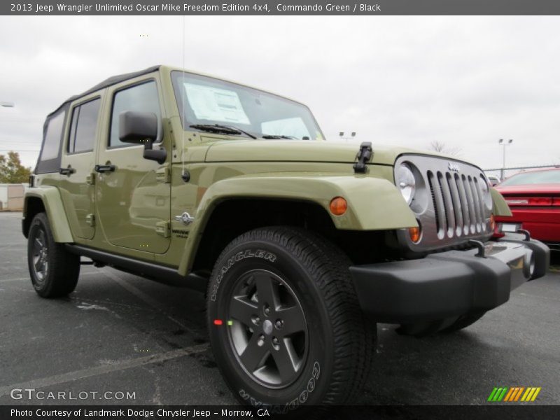 Front 3/4 View of 2013 Wrangler Unlimited Oscar Mike Freedom Edition 4x4