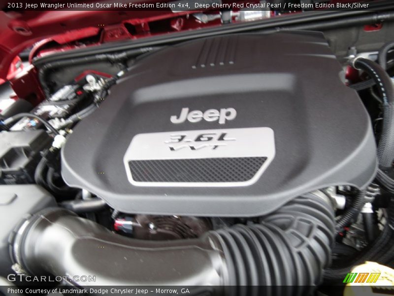 Deep Cherry Red Crystal Pearl / Freedom Edition Black/Silver 2013 Jeep Wrangler Unlimited Oscar Mike Freedom Edition 4x4