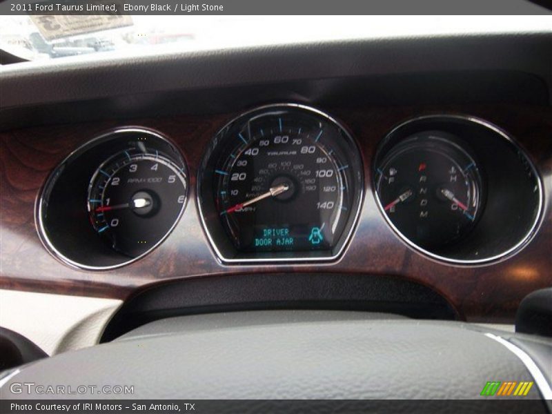 Ebony Black / Light Stone 2011 Ford Taurus Limited