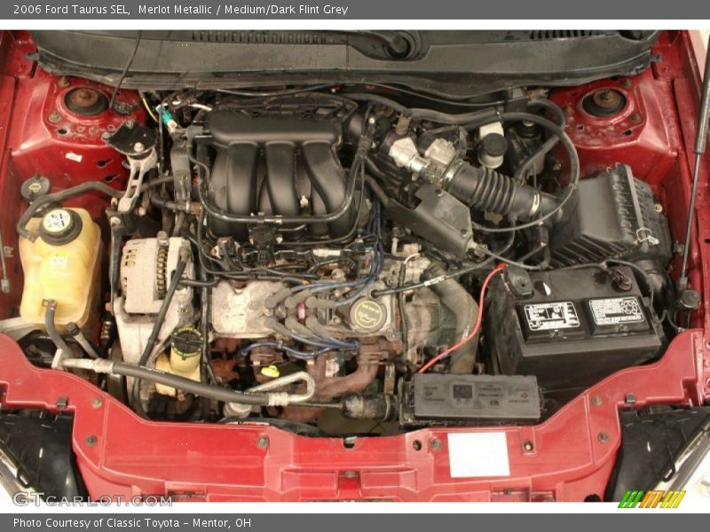 Merlot Metallic / Medium/Dark Flint Grey 2006 Ford Taurus SEL