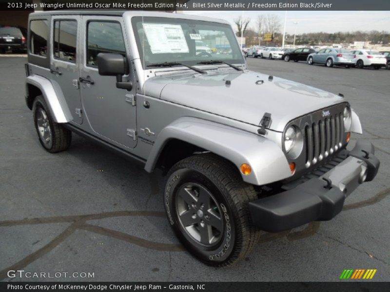 Front 3/4 View of 2013 Wrangler Unlimited Oscar Mike Freedom Edition 4x4
