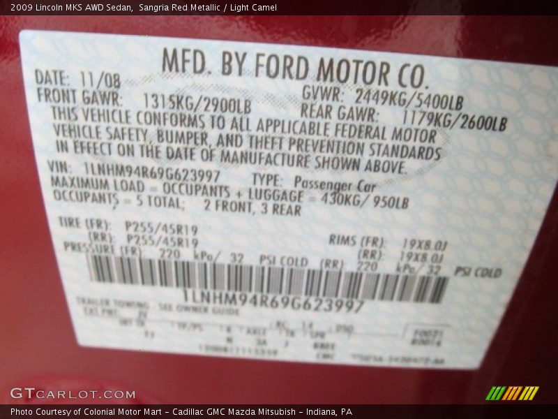 Sangria Red Metallic / Light Camel 2009 Lincoln MKS AWD Sedan