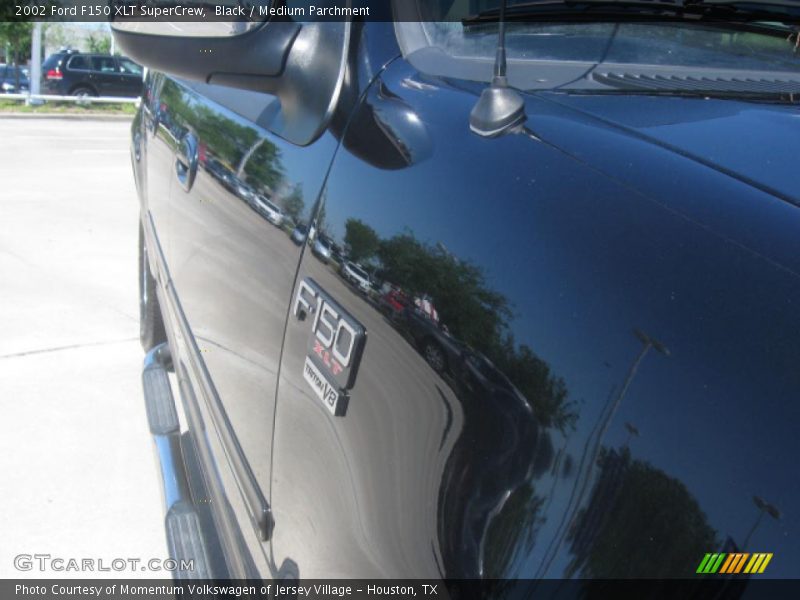Black / Medium Parchment 2002 Ford F150 XLT SuperCrew