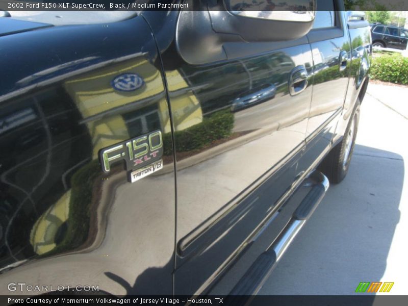 Black / Medium Parchment 2002 Ford F150 XLT SuperCrew