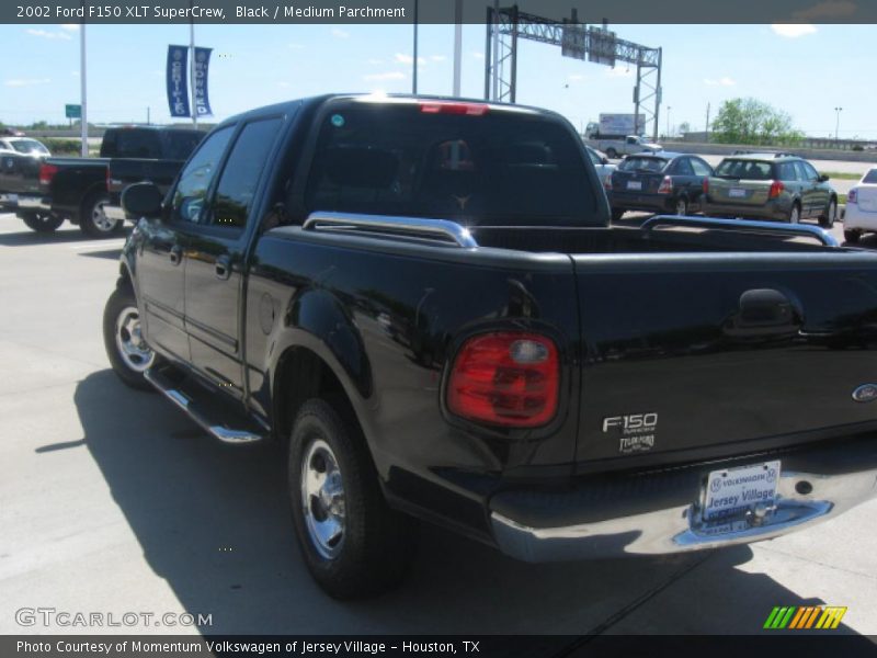 Black / Medium Parchment 2002 Ford F150 XLT SuperCrew